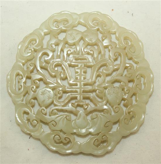 A Chinese celadon jade plaque, 19th century, 7.4cm